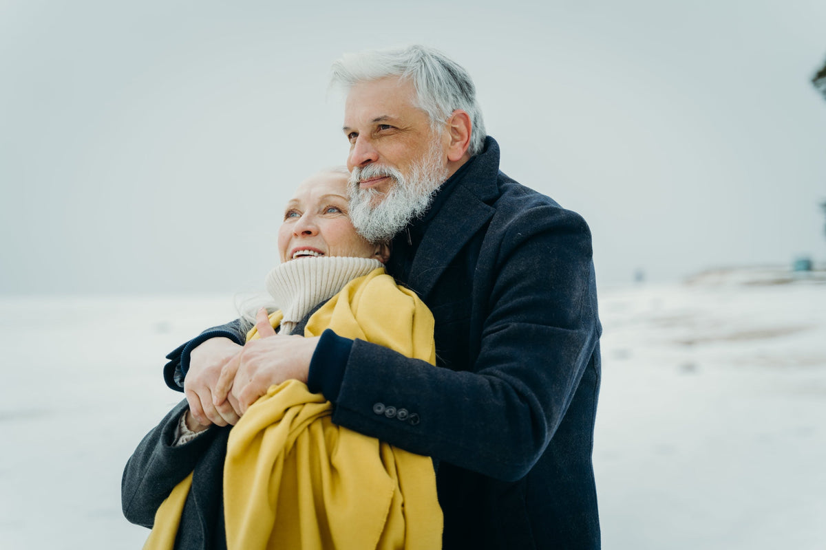 Older Couple Embracing in the Snow