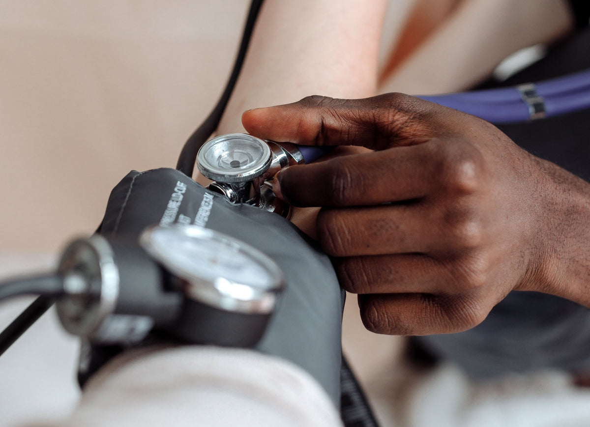 Taking a patient's blood pressure reading.